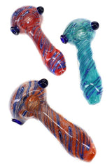 Three assorted silver-fumed frit glass spoon pipes with striped accents and dark blue marble details
