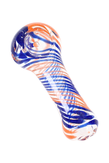 Small clear striped glass spoon pipe with orange and blue swirl accents, compact hand pipe angled on white background.