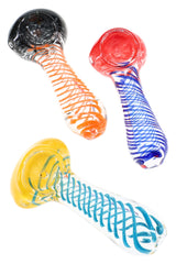 Top-down view of three clear spiral frit glass spoon pipes with mixed color coils, 3½″ assorted styles