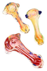 Assorted gold fumed glass spoon pipes with flowing stripes, raised bowl, and colorful dot details