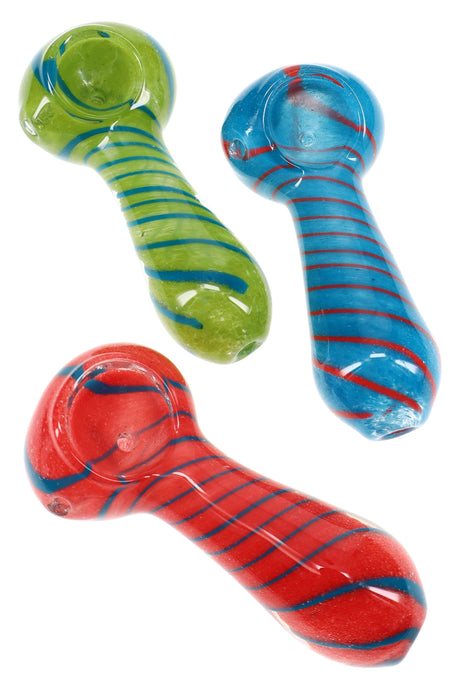 Assorted frit glass spoon pipes in red, green, and blue with spiral striped stems showing random color variety
