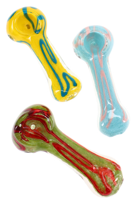 Assorted colorful glass hand pipes with bold stripe accents in yellow, aqua, and green-red designs on white