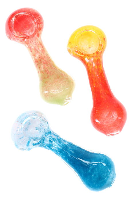Three 3-inch multicolor frit glass spoon pipes in red, yellow and blue speckles arranged diagonally on white background.