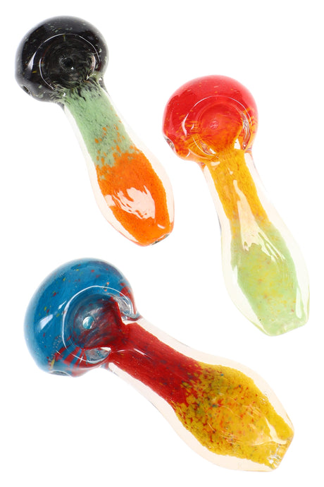Assorted frit glass hand pipes with colorful bowls and speckled ends, three pieces shown on white background