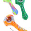 4-inch Eyce ORAFLEX silicone spoon with glossy clear outer layer, removable borosilicate bowl, and hidden metal poker, shown in Floral, Honeycomb, Spiral, and Switchback designs.