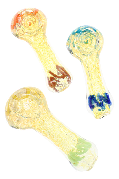 Assorted 3″ fumed color-changing glass spoon pipes with golden finish and colorful worked accents