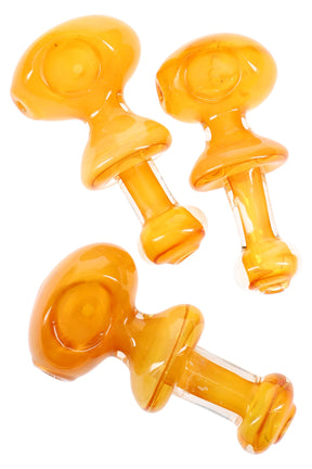 Gold-fumed color-changing glass spoon pipe with a central ring handle between bowl and mouthpiece, shown in assorted amber hues.