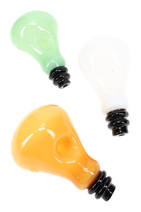 Assorted colored light bulb hand pipes in green, white, and amber glass with black screw-base mouthpieces