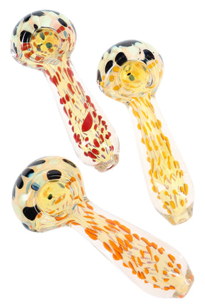 Clear 4-inch silver-fumed spoon pipe with vibrant neon glass dots, deep bowl, and side carb, shown on a white background.