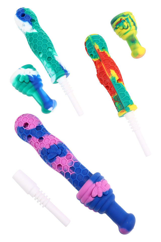 6½″ multicolor silicone honeycomb dab straw set with 14.5 mm ceramic tips; textured bee pattern grips and assorted colorways, sold individually.