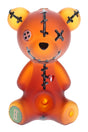 Frosted amber Hemper Scare Bears teddy bear glass hand pipe with black stitches and heart graphic standing upright on white.
