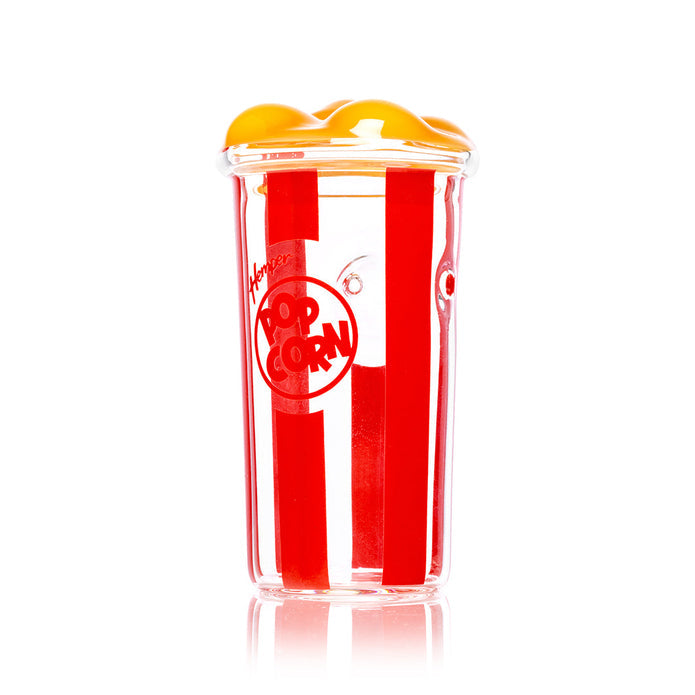 Angled side view of popcorn bucket glass hand pipe standing upright, compact grip-friendly novelty dry herb piece