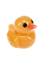 Angled view of yellow ducky-shaped glass hand pipe showing sculpted duck face and smooth glossy finish for dry herb