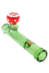 Angled close-up of green warp-tube glass pipe with red piranha flower bowl, thick borosilicate detail, 5″ long