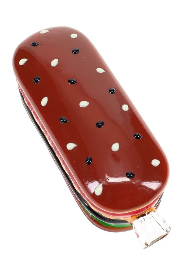 Top-down view of 5″ glass sandwich hand pipe with red bun, black seed dots, and top-loaded bowl opening