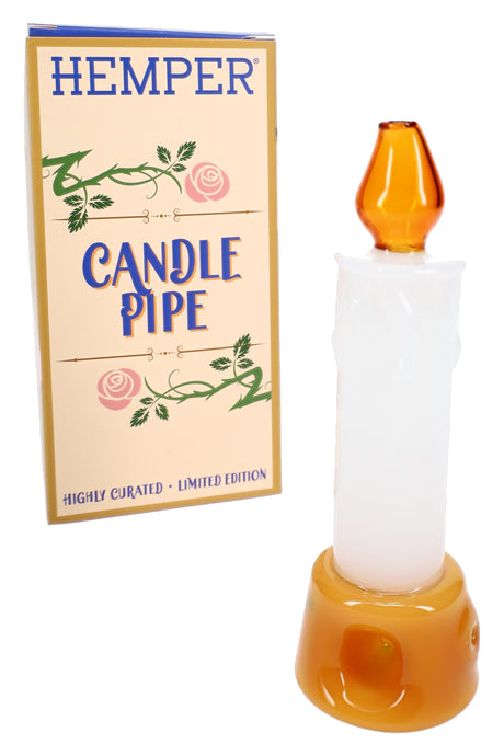 Hemper Tea Party candle glass hand pipe with box, white drip body, gold base, amber flame mouthpiece on display