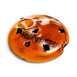 Close-up of cookie glass hand pipe bowl area with dark chip accents in amber glass for a compact hand pipe look