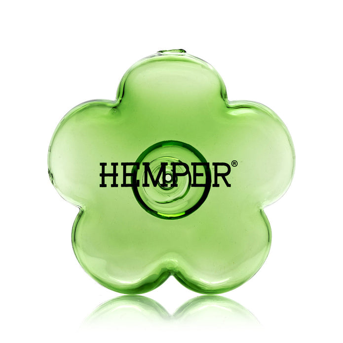 Front view of green flower glass hand pipe highlighting Hemper logo decal and glossy transparent finish on the petals