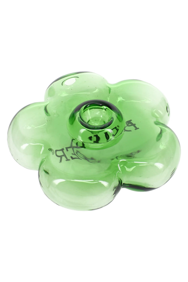 Top-angle close-up of transparent green flower-shaped glass hand pipe showing petal contours and centered bowl area