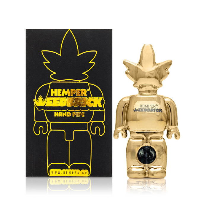 Boxed Hemper Weedbrick hand pipe set, shelf-ready packaging with mirror-gold character pipe for giftable display