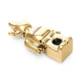 Angled top view of mirror-gold Weedbrick glass hand pipe lying down with bowl opening visible and dark bowl accent