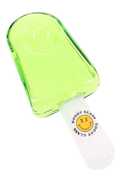 Neon green popsicle novelty hand pipe with white stick handle in angled glass product photo