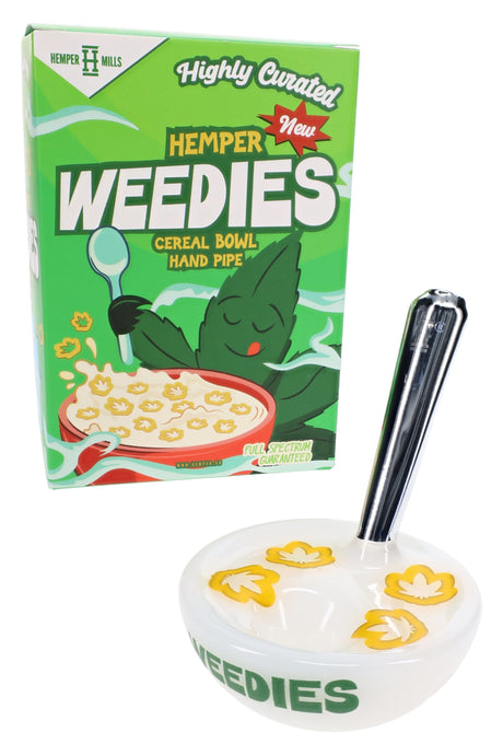 Hemper Weedies cereal bowl hand pipe beside green retail box with clear upright mouthpiece