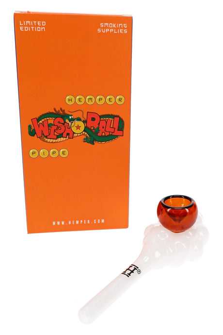 HEMPER Wish Ball glass hand pipe beside orange retail box with white cloud body and amber bowl