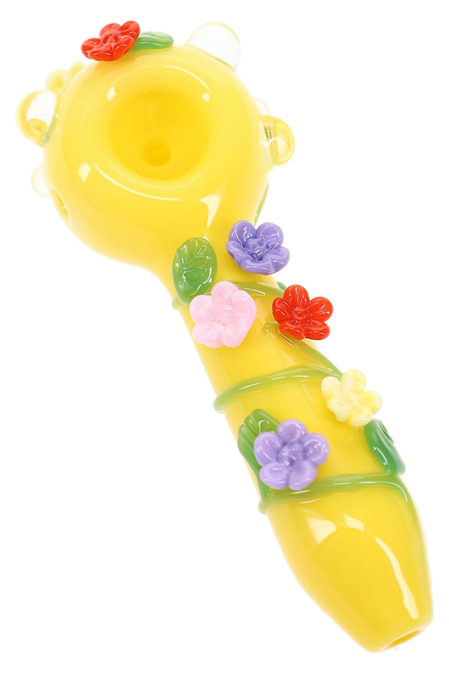 Empire Glassworks Sunshine Garden spoon pipe side view with yellow body and colorful floral glass accents