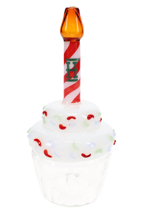 Cupcake-shaped glass hand pipe with white sprinkle top, clear base, and red swirl candle stem