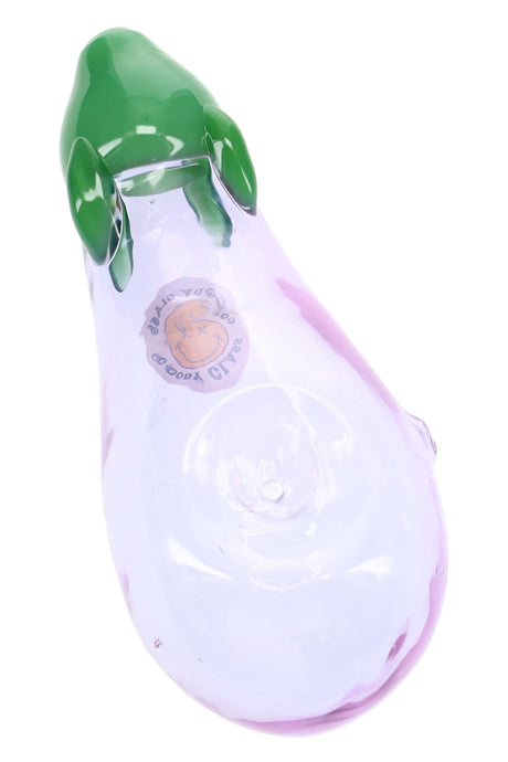 Purple eggplant-shaped glass hand pipe with green top, bowl detail, and Goody produce sticker