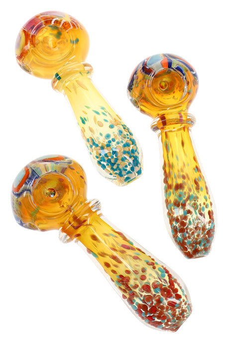 Assorted 4″ gold fumed glass spoon pipes with colorful frit handles, ring accents, and striped bowls