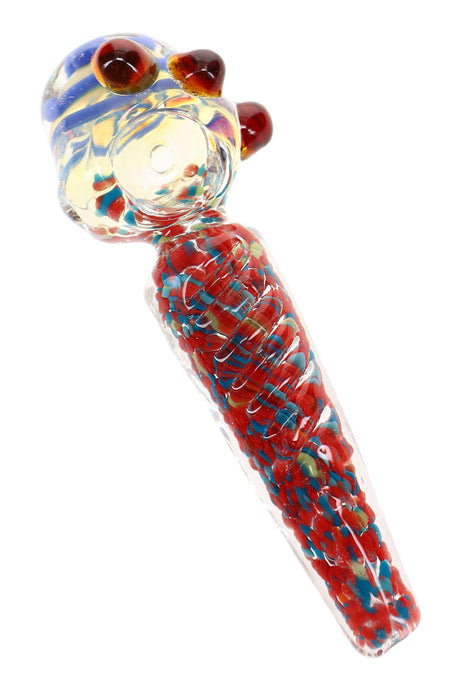 Close-up of 4½″ glass spoon pipe with blue striped bowl, red and blue confetti frit, and marbles