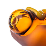 Close-up of BigFun! Glizzy glass hand pipe mouthpiece with rounded amber borosilicate glass opening