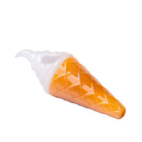 Side view of ice cream glass hand pipe with white swirl top, orange waffle cone texture, and mouthpiece tip