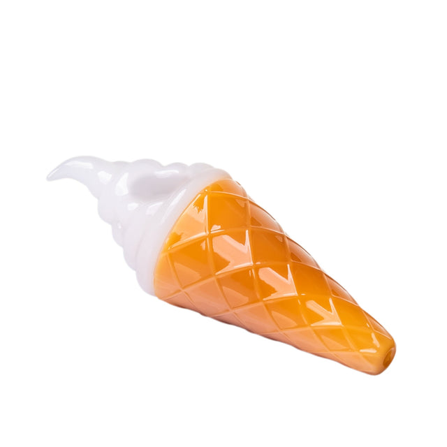 Side view of ice cream glass hand pipe with white swirl top, orange waffle cone texture, and mouthpiece tip