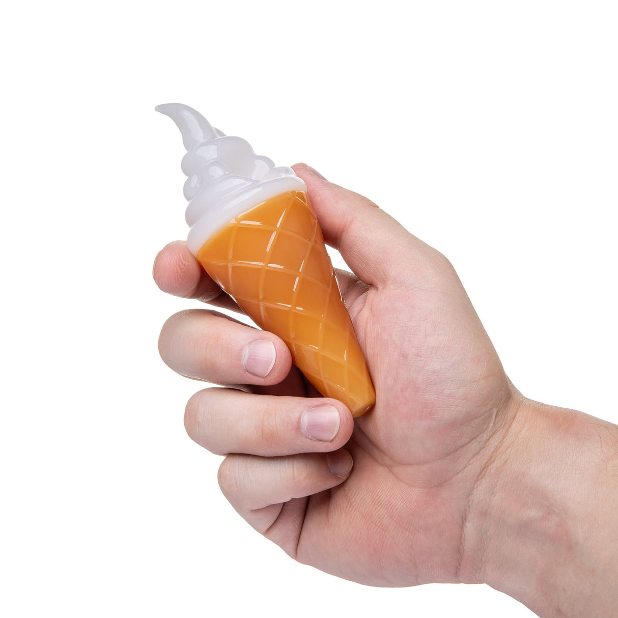 Hand holding 4½″ ice cream glass hand pipe showing compact size, white swirl top, and orange cone body