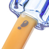 Close-up of BigFun! Pipesicle glass hand pipe yellow stick with printed BigFun! exclamation-mark logo