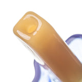 Close-up of BigFun! Pipesicle glass hand pipe yellow stick showing the rounded end and hollow airpath opening