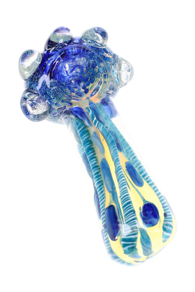 Blue color-changing glass hand pipe with frit bowl, raised clear marbles, striped stem, and spoon shape