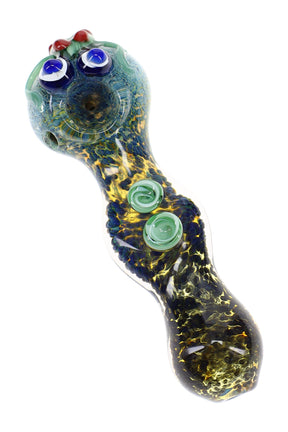 Silver-fumed frit critter glass hand pipe with blue eyes, green raised marbles, round bowl, and spoon stem