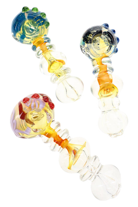 Assorted gold fumed glass hand pipes with striped bowls, colored marbles, and clear ring accents