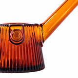 Close-up of Baltic Amber NWTN Home Deco glass pipe showing fluted texture, carb and angled stem