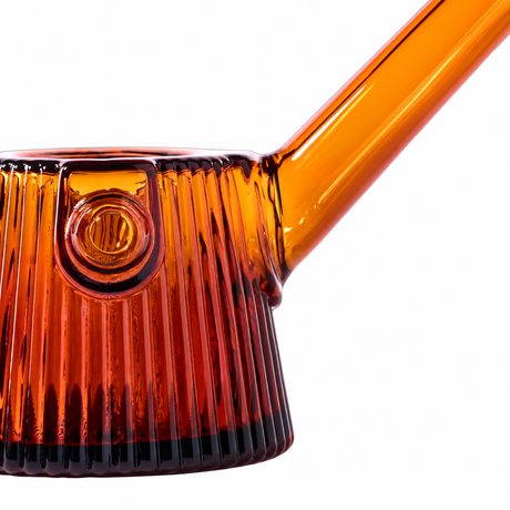 Close-up of Baltic Amber NWTN Home Deco glass pipe showing fluted texture, carb and angled stem