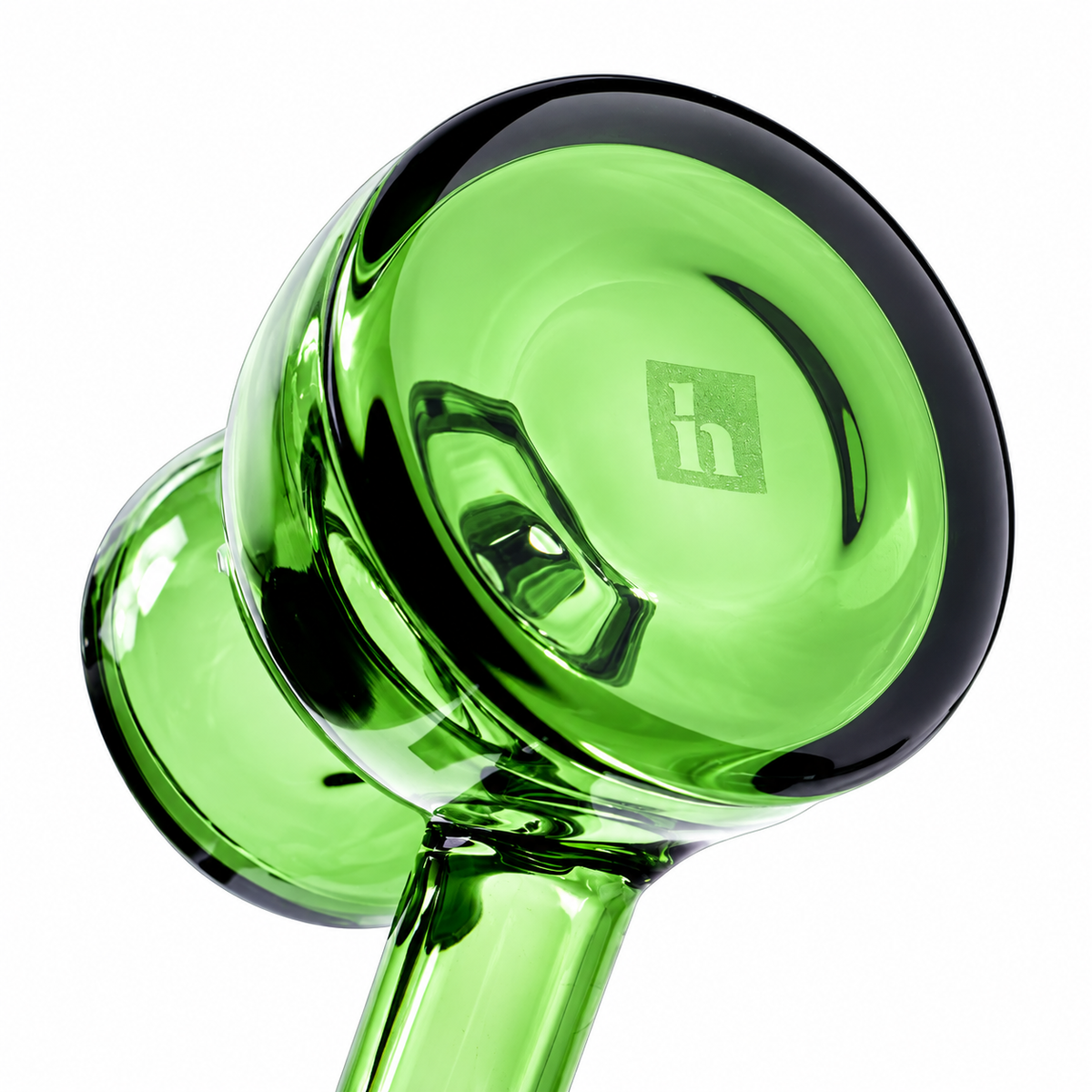 Bottom view of emerald NWTN Home Vesper glass hand pipe showing the thick circular base and etched logo