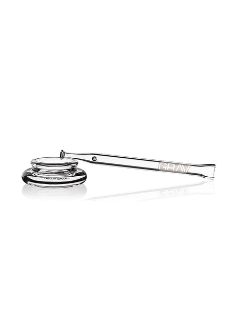 GRAV quartz dab straw resting diagonally across the rim of the matching clear dab dish.