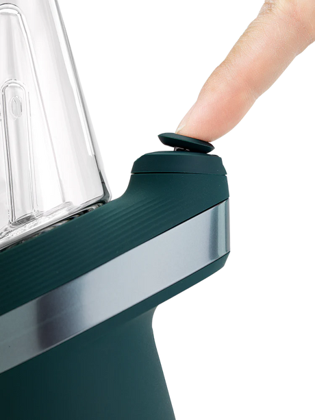 Closeup of Joystick Cap on Puffco New Peak Pine, finger pressing the top for directional airflow control.