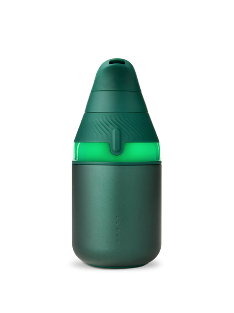 Pine Puffco Proxy Core vaporizer powered on with glowing green light band and matte body