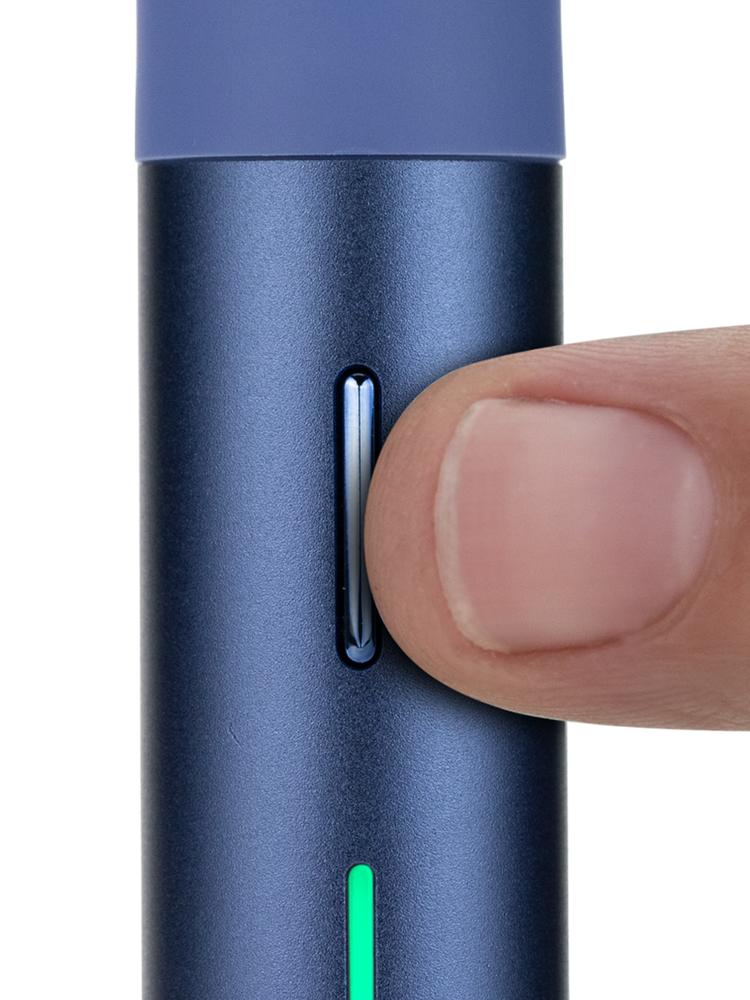 Puffco Pivot Sapphire dab pen close-up with finger pressing the slim control button