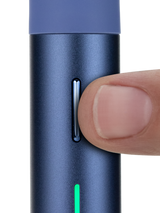 Puffco Pivot Sapphire dab pen close-up with finger pressing the slim control button
